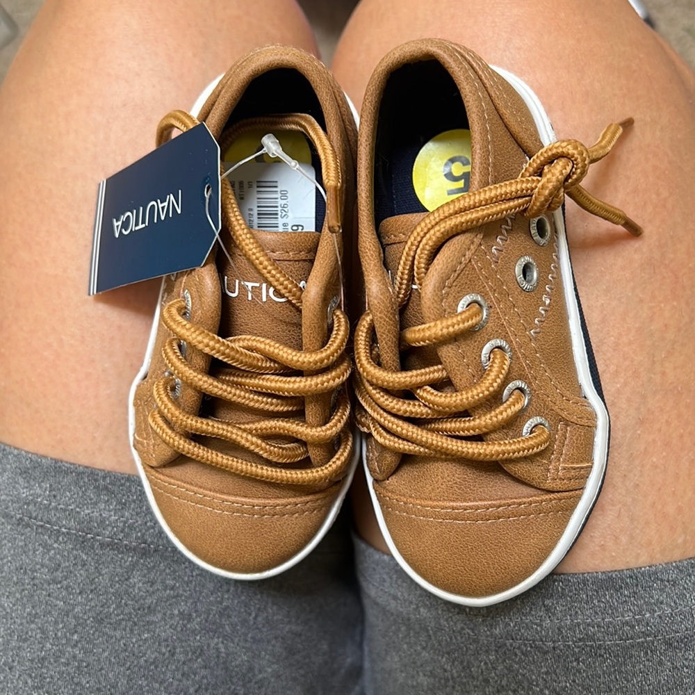 Brown boat shoes. Size 5c. Never worn. No box.